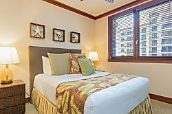Beach Villas at Ko Olina O-521 - The second guest bedroom full of oceanic charm and a queen bed.