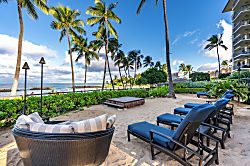 Beach Villas at Ko Olina O-521 - Claim a chaise by the pool with the beach just past the palms.