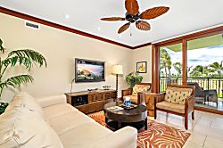 Beach Villas at Ko Olina B-308 - This living room feels like a resort retreat—leafy palms indoors and swaying ones just out
