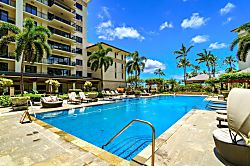 Beach Villas at Ko Olina B-308 - The pool’s calm waters reflect the lush greenery, creating a serene ambiance for every gue