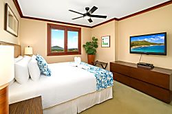Beach Villas at Ko Olina O-1604 - This king-sized bed is dressed in island florals and cloud-soft pillows, making it the cro