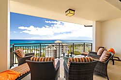 Beach Villas at Ko Olina O-1604 - With stripe-clad chairs and ocean-stretched views, this lanai feels like a beach club in t