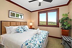 Beach Villas at Ko Olina O-1604 - Wrapped in tropical blues and crisp white linens, this king bed invites you to sink, spra