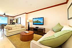 Beach Villas at Ko Olina O-1604 - This living room is a quiet hug in beige and sage, where modern comfort meets the island’s