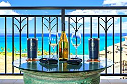 Beach Villas at Ko Olina O-1604 - Every detail sets the scene—from custom tumblers to a bottle of wine—all against the turqu