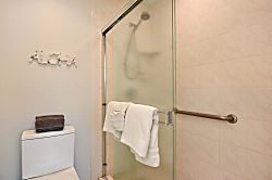Napili Point B5 - Refresh in the walk-in shower featuring a glass door, safety handrail, handheld showerhead