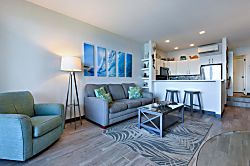 Napili Point B5 - Relax on the sleeper sofa surrounded by wave art canvas prints, with easy sightlines to th