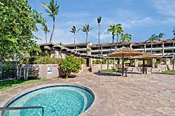 Kaanapali Royal B303 - Towering palm trees sway gently against a bright, cloudless sky, surrounded by vibrant gre