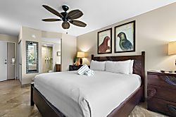 Maui Banyan T304 - Your tropical bedroom features comfortable bedding, artwork, and a soothing ceiling fan fo