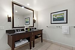 Honua Kai Hokulani 204 - The master bath features granite finishes and walk-in shower