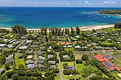 Hale Kanani Steps to Hanalei Bay  - The turquoise water of Hanalei Bay curves just beyond the rooftops.