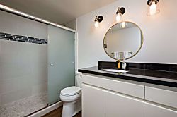 Lauloa 212 - Start your day right! This master bathroom features a modern, remodeled walk-in shower for