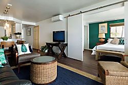 Lauloa 212 - Relax in our comfy living room, flowing seamlessly into the tranquil master bedroom oasis.