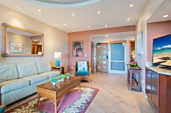 Kapalua Ridge Villas 1614 - In the living room you will find a flat screen TV, sofa, chairs, coffee table and vaulted