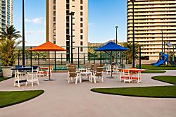 Waikiki Banyan Plumeria Suite - Lovely seating are to enjoy after cooking on the fabulous BBQ's