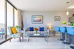 Waikiki Banyan 3401 T2 - Bright living room with modern seating and a glass coffee table.