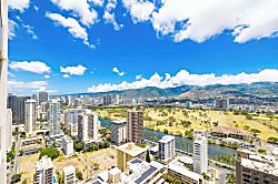 Waikiki Banyan 3401 T2 - Cityscape view with a golf course and mountains under a bright blue sky.