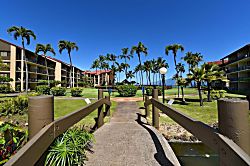 Papakea Resort D108 - Cross wooden bridges where resort charm meets nature.