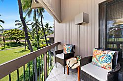 Kanaloa at Kona 1606 - A quiet corner lanai with two chairs and a view into the palms.