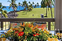 Kanaloa at Kona 1606 - A tropical arrangement on the rail, the fairway stretching green behind it.