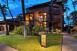 Kanaloa at Kona 1606 - Evening settles over the low wood-frame buildings and the paths winding between them.