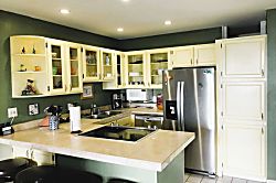 Shores of Maui Unit 220 - Fully equipped kitchen has stainless appliances.