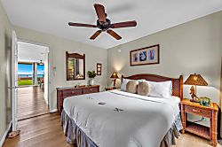 Kulakane 105 - Comfortable bedroom retreat with elegant island décor and ample natural light.