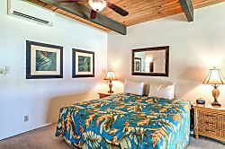 Napili Point NAP-C42 - Charming loft retreat with a tropical bedspread, wood accents, warm lighting, and balcony