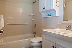 Hanalei Colony Resort K4  - bathroom 1, full bathroom with tub/shower - Down the hall from the primary bedroom you'll
