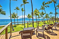 Oceanfront Oasis in Lahaina - Oceanfront paradise awaits on this spacious lanai with wicker seating, swaying palms, and