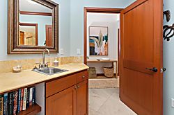 Kolea 11C - Your private ensuite features warm wood tones, peaceful blue walls, and thoughtful touches