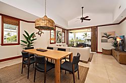Kolea 11C - Gather around the handsome wood dining table beneath a tropical woven pendant, where ocean