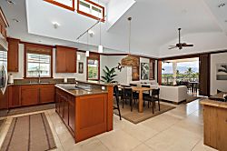 Kolea 11C - Step into your open-concept living space where rich wood accents and vaulted ceilings crea