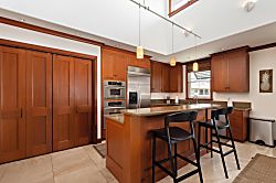 Kolea 11C - Your gourmet kitchen awaits with granite countertops, stainless steel appliances, and a ce