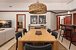 Kolea 11C - Picture yourself gathering around this stunning wood table, where a handcrafted woven pend