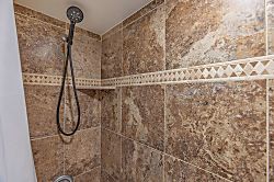 Maui Vista 2118 - Rinse off after a day of adventure in this spacious walk-in shower with earthy tile work a