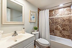 Maui Vista 2118 - Freshen up in your private bathroom with a soothing shower and modern marble-look tile.