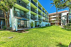 Maui Vista 2118 - The property features tropical landscaping with palm trees and lush lawns. Multiple buildi