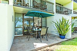 Maui Vista 2118 - Your private patio awaits, complete with outdoor dining and a cheerful blue umbrella—perfe