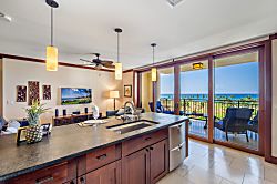 Beach Villas at Ko Olina O-703 - Open concept kitchen with ocean views from the lanai