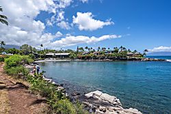 Napili Point B35 - A scenic coastal cove with turquoise waters, rocky shoreline, and lush tropical vegetation