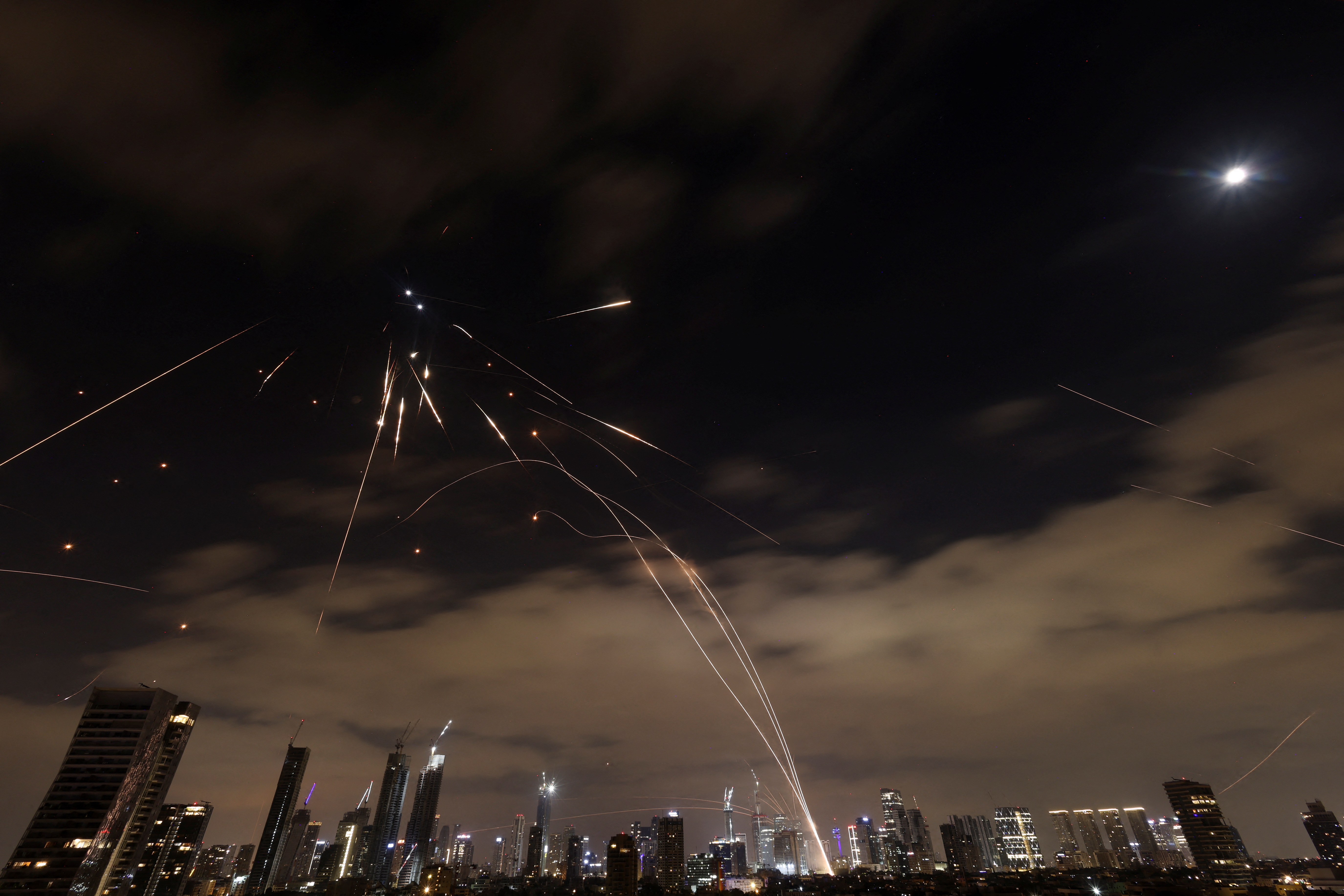 Israeli security and rescue forces at the scene where a ballistic missile fired from Iran hit and caused damage in Petah Tikva, June 16, 2025. Photo by Chaim Goldberg/Flash90