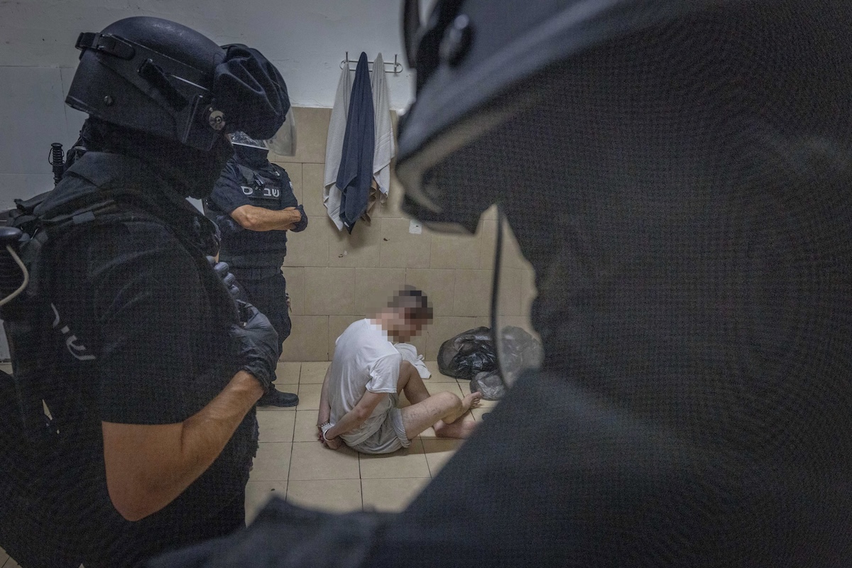 Israeli prison service guards operate in a special wing of Israeli citizens accused of spying for Iran, in the Damon Prison, in the Druze town of Daliyat al-Karmel, northern Israel, July 1, 2025. (Photo: Chaim Goldberg/Flash90)