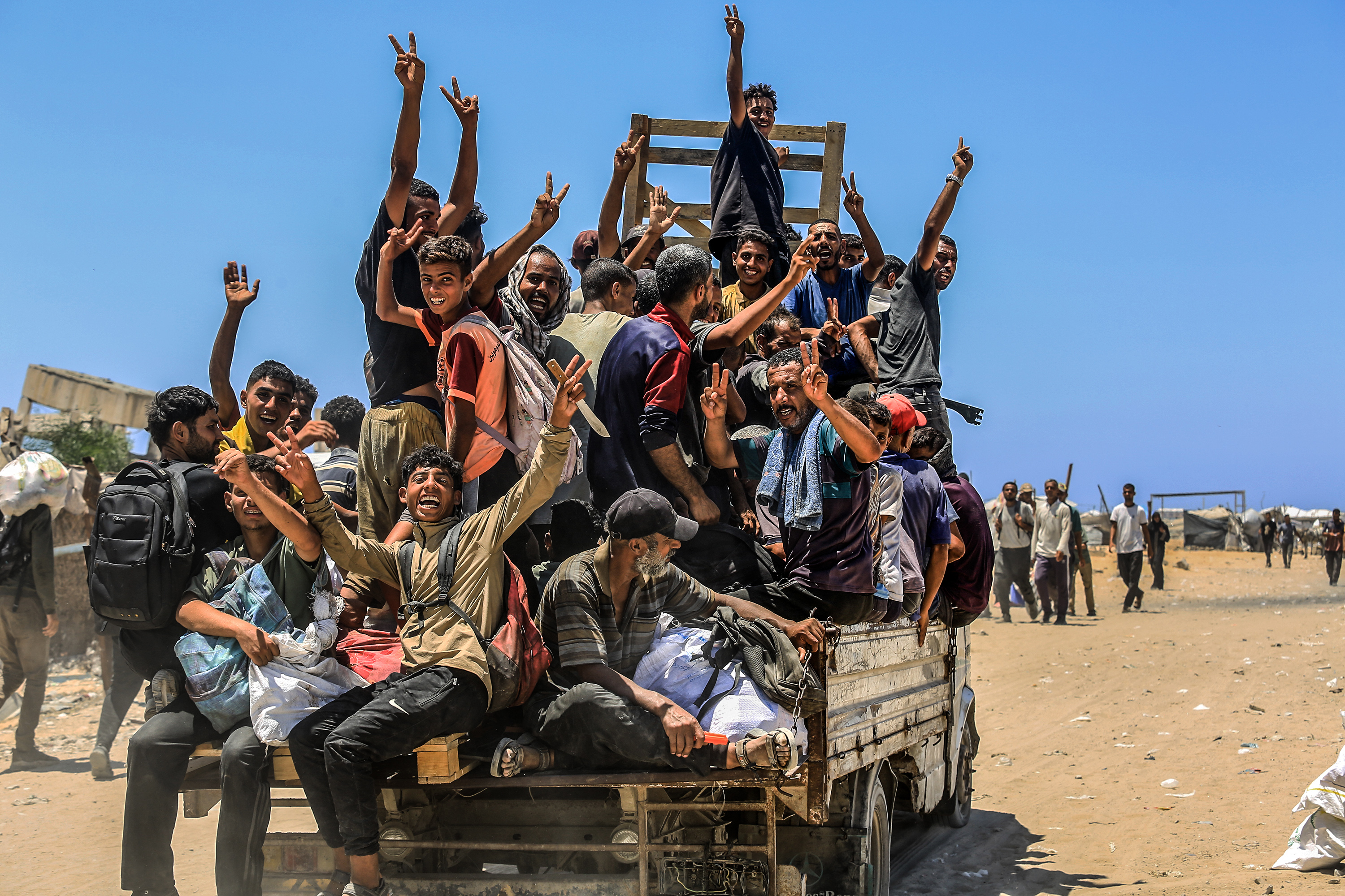 Palestinians receive meals from volunteers in Gaza City, July 28, 2025. (Photo: Ali Hassan/Flash90)
