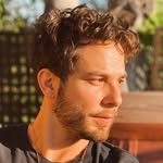 Skylar Astin logo