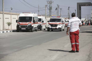 Illustrative - Palestinian health ministry ambulances arrive outside the Rafah border before crossing into Egypt, Nov. 1, 2023.