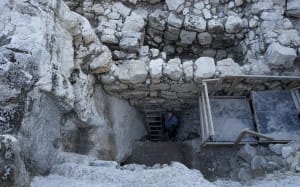 Prof. Yuval Gadot at the bottom of the Jerusalem moat (Photo: Erik Marmor/Courtesy of the City of David)
