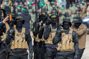 Palestinian Islamic Jihad militants stand guard before the handover of hostages who had been held in Gaza since the deadly October 7, 2023 attack, to members of the International Committee of the Red Cross (ICRC) as part of a ceasefire and a hostages-prisoners swap deal between Hamas and Israel, in Gaza City, January 25, 2025. (Photo: REUTERS/Dawoud Abu Alkas)