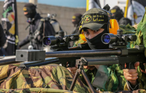 Members of the Saraya al-Quds Brigades, the armed wing of the Palestinian Islamic Jihad movement, take part in a military parade in Al-Shati refugee camp, west of Gaza City, June 24, 2022. (Photo: Attia Muhammed/Flash90)