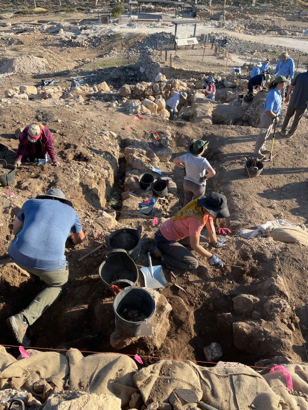 Gary Urie photographing an important stone at Tel Shiloh (Photo courtesy Scott Stripling)